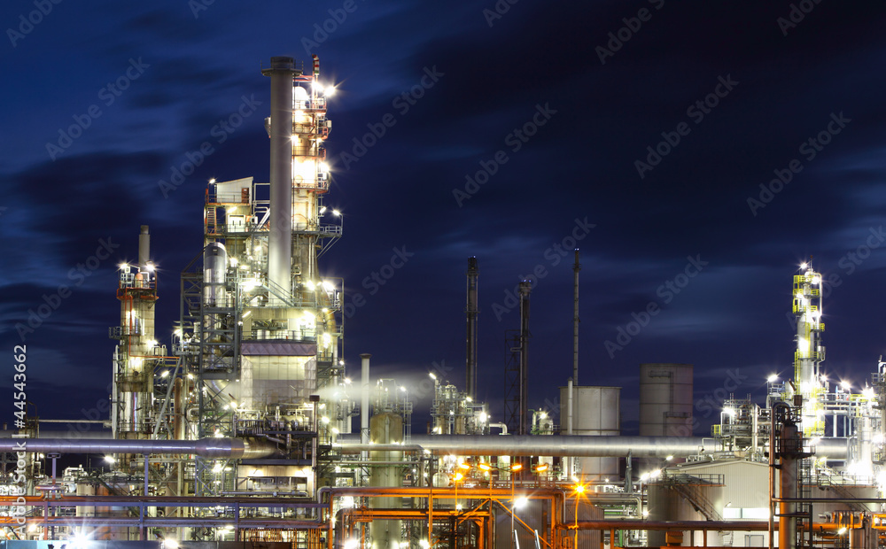Oil and gas refinery plant at night - Petrochemical factory Oil and gas refinery plant at night - Petrochemical factory