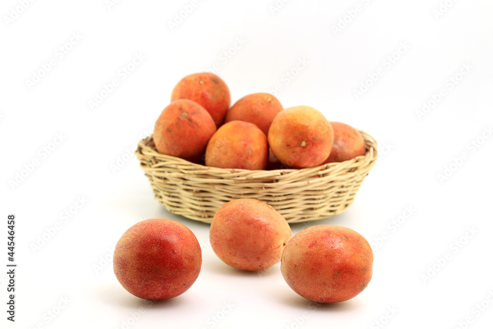 Group of Passion fruit in wood basket on white background Group of Passion fruit in wood basket on white background