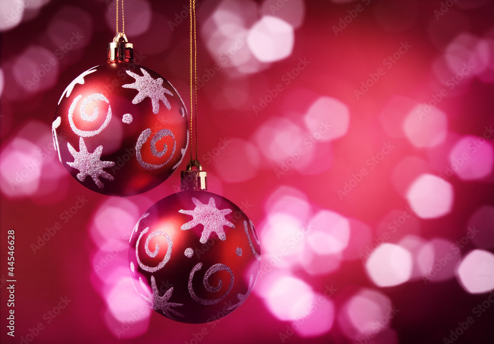 Fototapeta premium Christmas balls over red background.