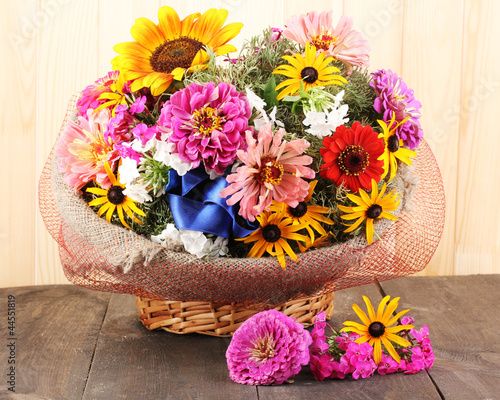 Beautiful bouquet of bright flowers in sacking photo