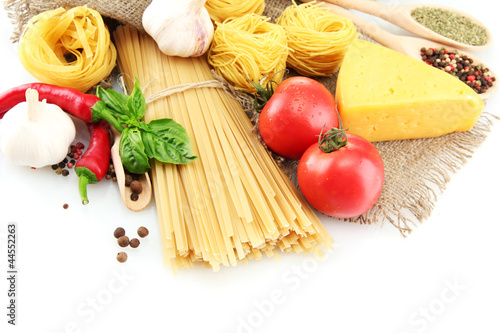 Pasta spaghetti, vegetables and spices, isolated on white