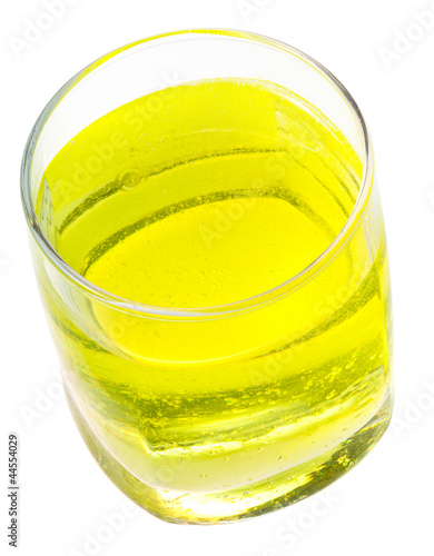 glass of yellow carbonated water with vitamin photo