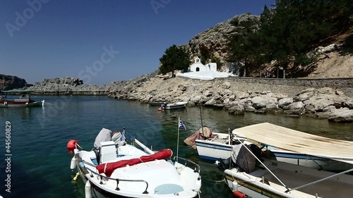 Fishing boats and church in St Paul's bay, Lindos, Rhodes