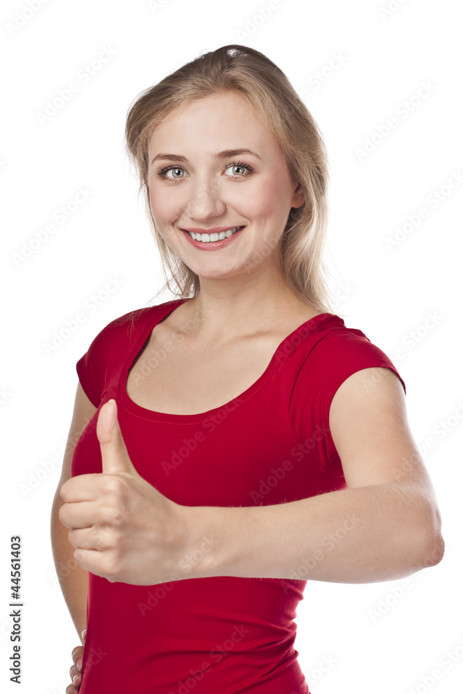 Attractive smiling blond in studio, thumbs up Attractive smiling blond in studio, thumbs up