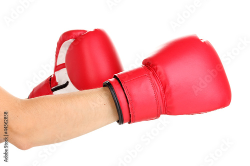Red boxing gloves on hands isolated on white