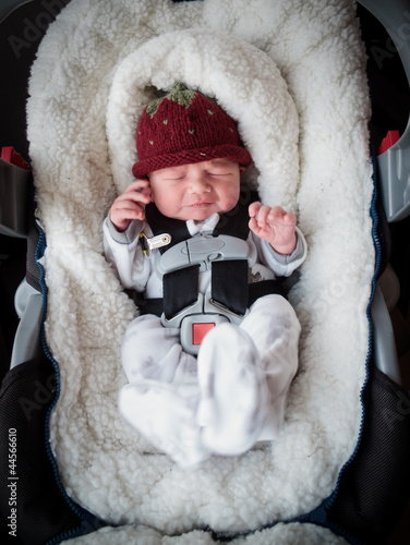 Newborn boy in car seat