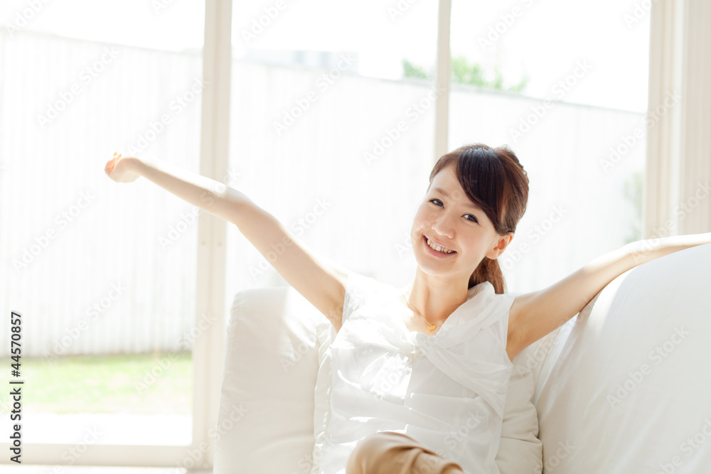 Beautiful young woman relaxing in the room Beautiful young woman relaxing in the room