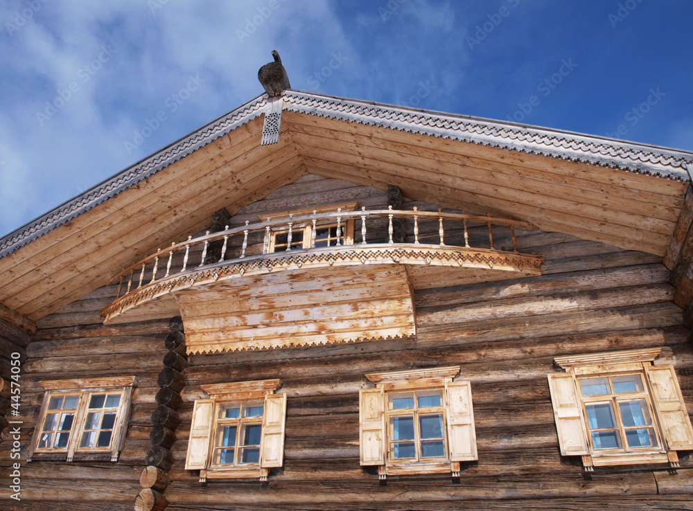 A facade of a russian traditional wooden house