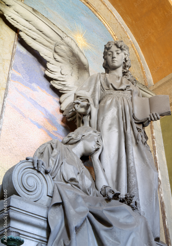 historic tombstone with angel holding a bible