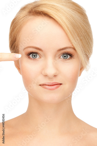 beautiful woman pointing to eye