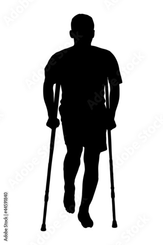 A silhouette of an injured man on crutches