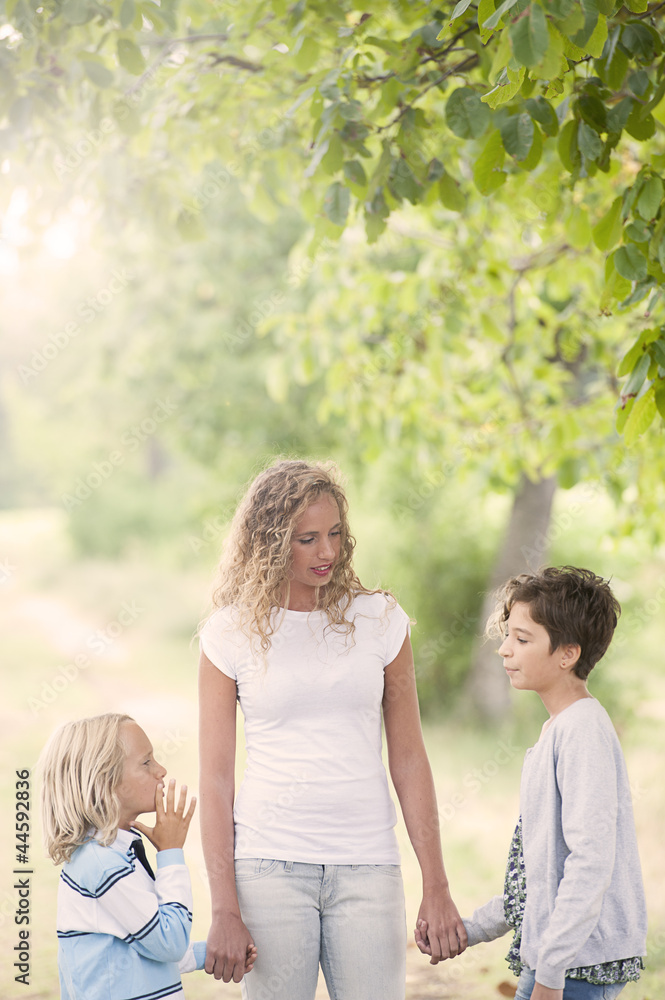 Smiling mother and little sons - family happiness Smiling mother and little sons - family happiness
