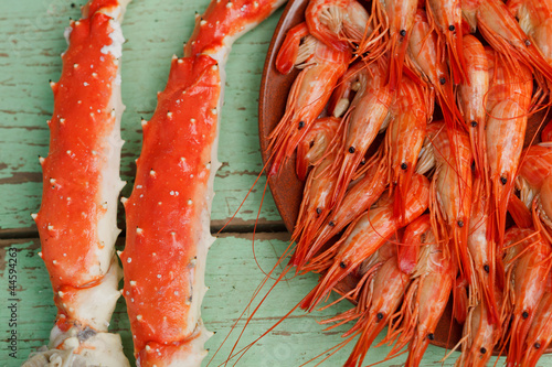 Cooked shrimp and crab legs photo