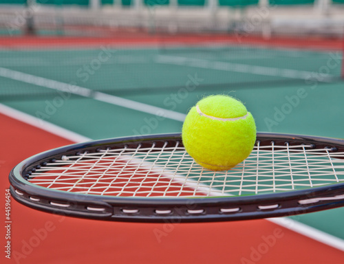 Tennis court with ball and racket © PinkBlue
