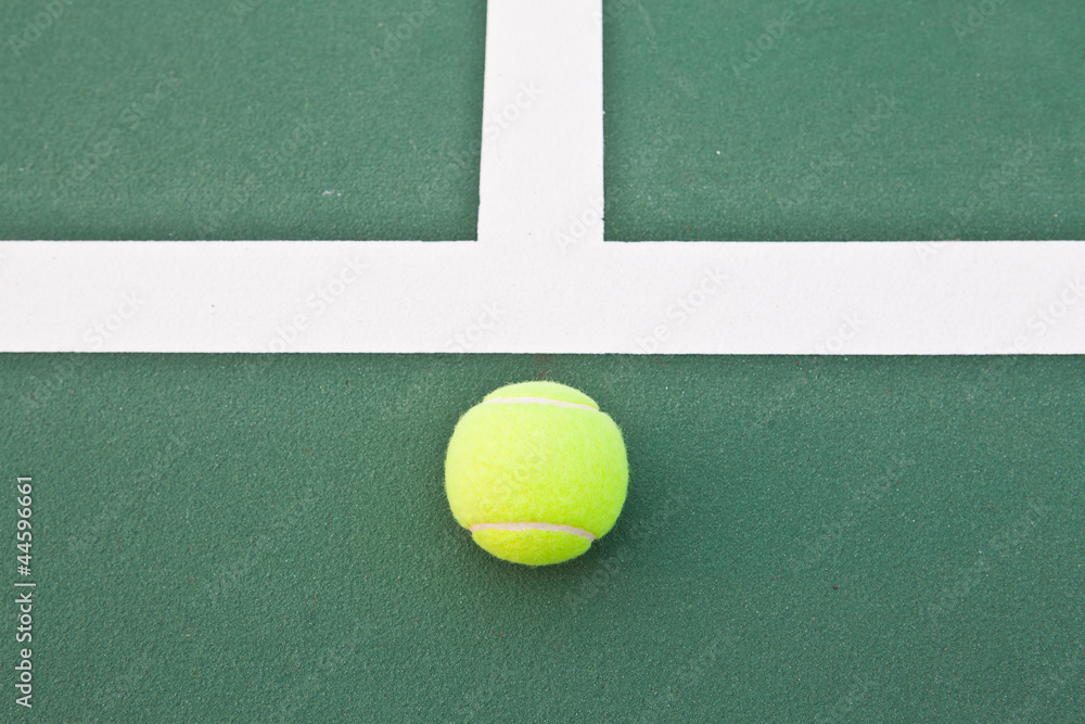 Tennis court at base line with ball