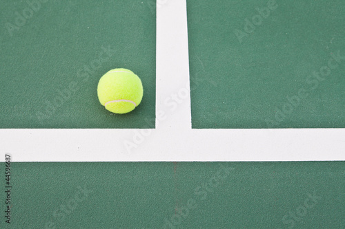 Tennis court at base line with ball © PinkBlue