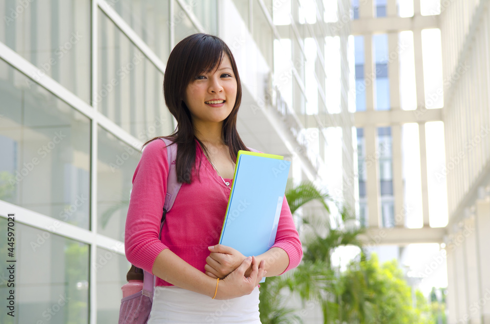 College Student standing outside college building College Student standing outside college building