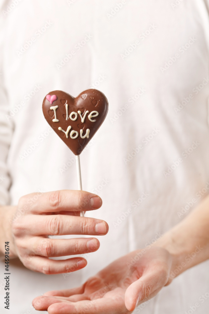 man with chocolate heart in the hands man with chocolate heart in the hands