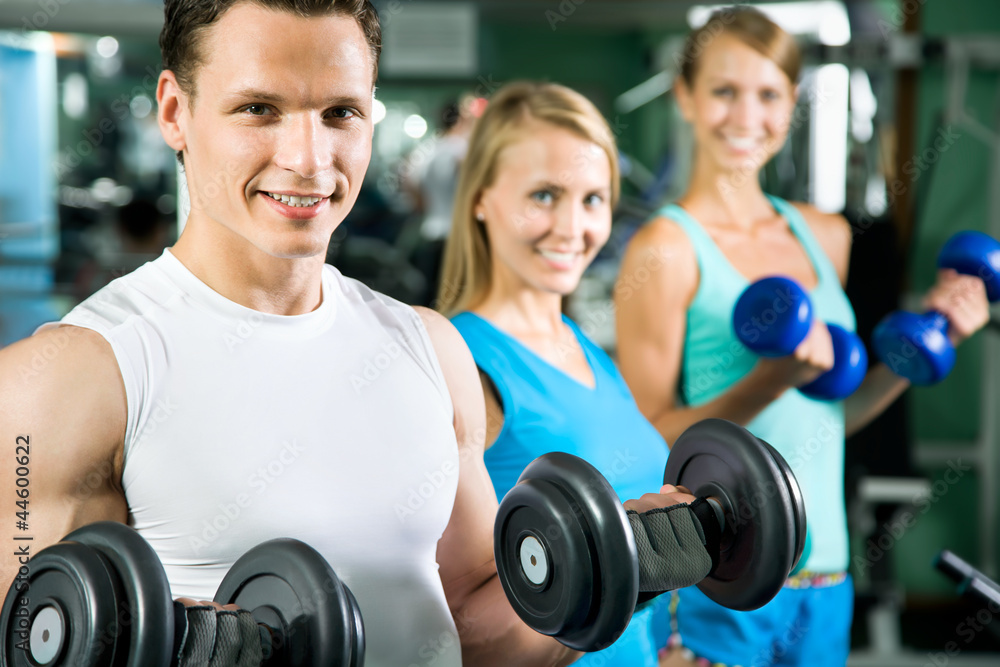 Man with weight training equipment Man with weight training equipment