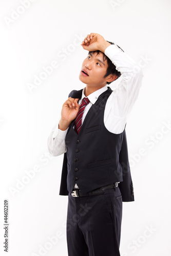 A tired Asian business man isolated on white background. © 현수 김
