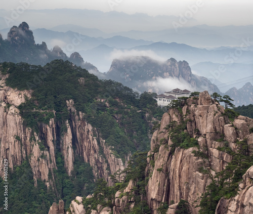 Huangshan mountain and Chinese style house at cloudy weather