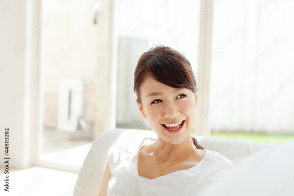 Beautiful young woman relaxing in the room. Portrait of asian. Beautiful young woman relaxing in the room. Portrait of asian.