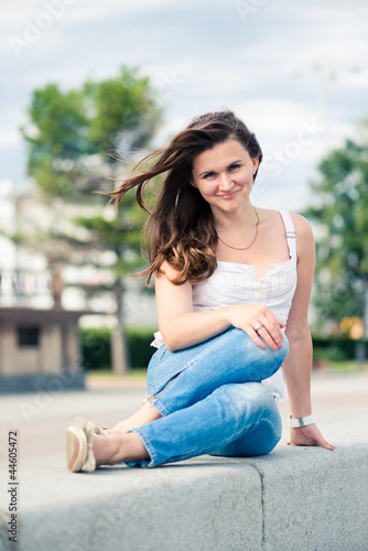 Free Download Portrait of a beautiful european woman smiling outdoors - GFXLoad