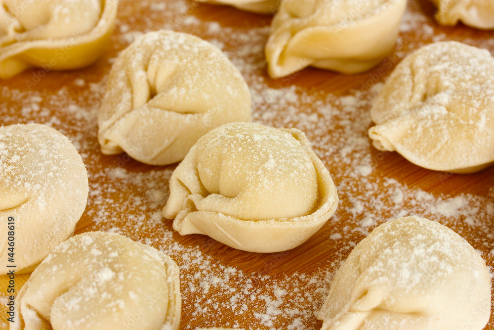 Raw Dumplings on cutting board close-up Raw Dumplings on cutting board close-up