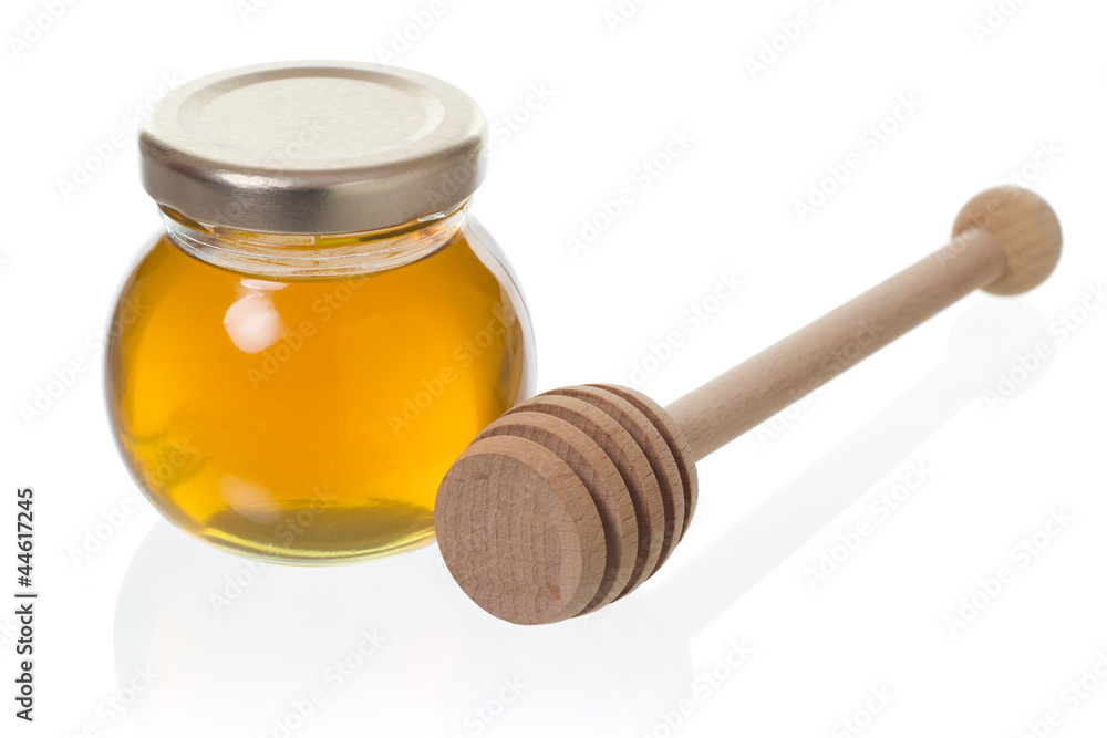 Jar of honey with dipper Jar of honey with dipper