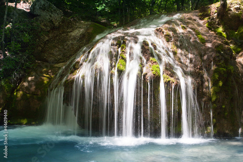 Fototapeta Naklejka Na Ścianę i Meble -  Small waterfall in deep forest