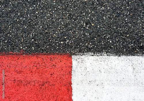 Texture of race asphalt and curb on Grand Prix circuit