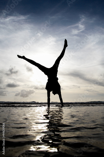 silhouette gymnast in water