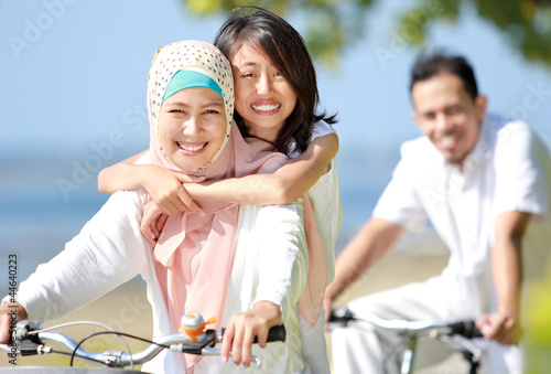 Canvas Print happy family riding bikes