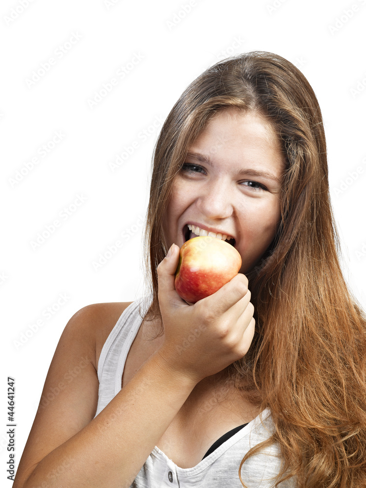 Young beautiful woman with an apple looking towards camera Young beautiful woman with an apple looking towards camera