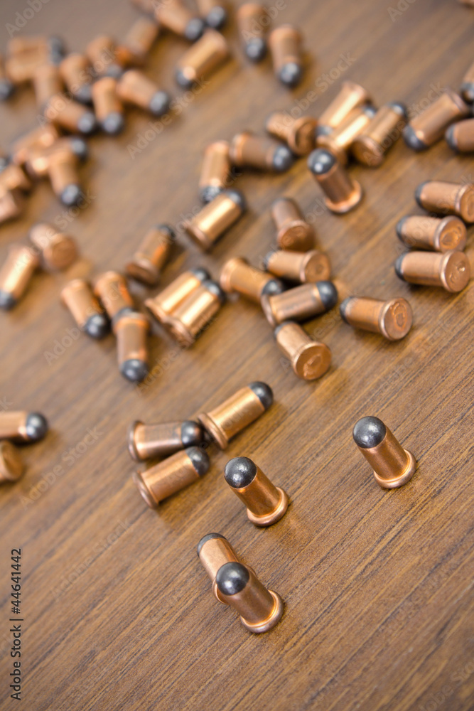 bullets on wood background bullets on wood background