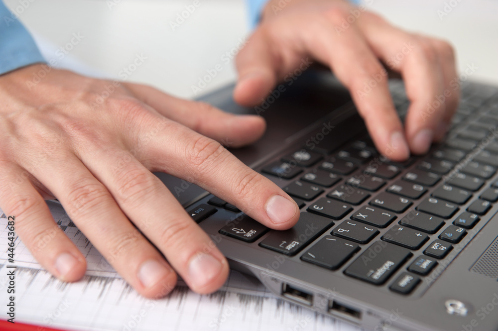 Close-up of male hands with laptop Close-up of male hands with laptop
