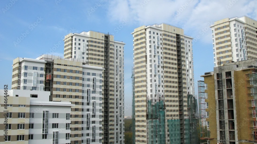 Clouds float above considerable quantity of new buildings Clouds float above considerable quantity of new buildings