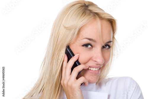 Young smiling beautiful woman-nurse talks by mobile phone