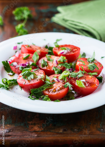 Tomato salad with onion and fresh herbs