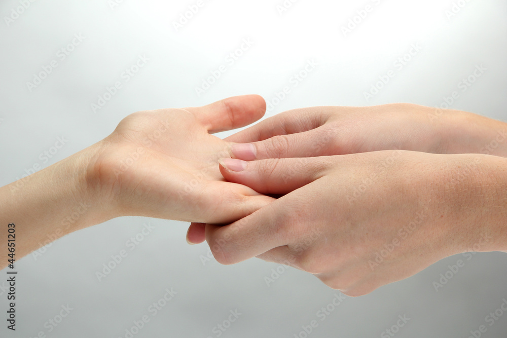 Hand massage, on grey background