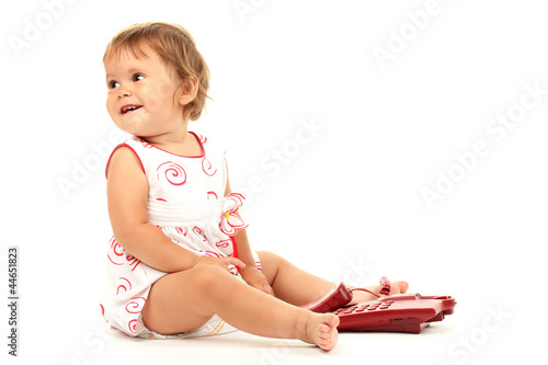 Cute baby with telephone isolated on white