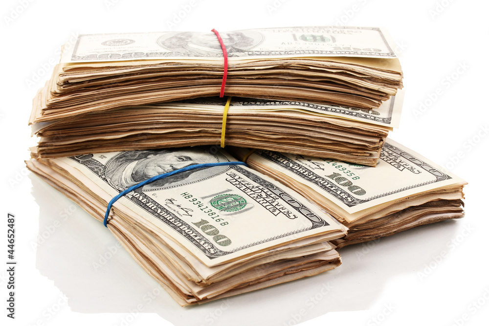 Stacks of one hundred dollars banknotes close-up isolated Stacks of one hundred dollars banknotes close-up isolated