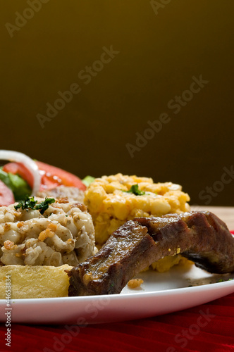 Ecuadorian food series: pork rib with corn salad photo