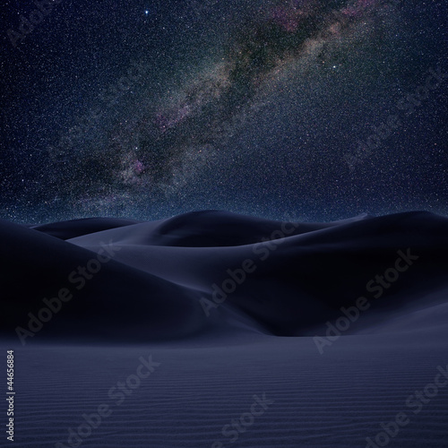 Desert dunes sand in milky way stars night