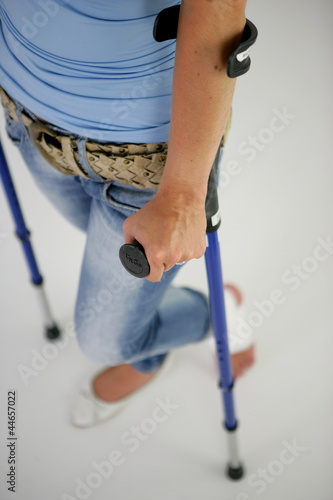 Close-up on a women on crutches photo