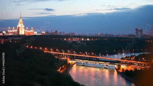 Luzhnetsky bridge stands against Moscow State university photo