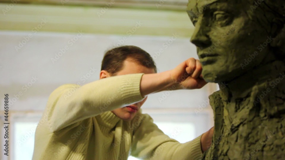 Sculptor Denis Petrov puts pieces of clay on A.Suvorov bust Sculptor Denis Petrov puts pieces of clay on A.Suvorov bust