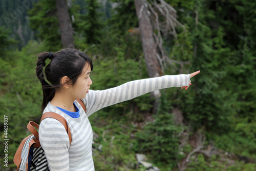 Asian girl pointing out