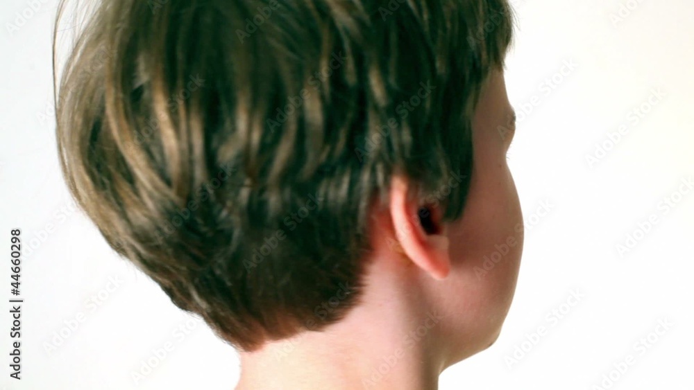 Little boy looks and turn around, only head visible isolated Little boy looks and turn around, only head visible isolated