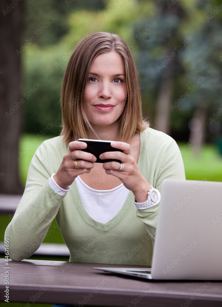 Portrait of Woman in Park with Mobile Phone Portrait of Woman in Park with Mobile Phone